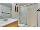 Clean bathroom features a modern vanity and a shower with glass sliding doors at 3930 University Center Dr # 409, Las Vegas, NV 89119