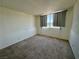 Bedroom with neutral carpet, curtained window providing natural light at 3930 University Center Dr # 409, Las Vegas, NV 89119