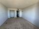 Bedroom featuring neutral carpet, large closet, and plenty of natural light at 3930 University Center Dr # 409, Las Vegas, NV 89119
