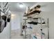Organized kitchen storage shelves showcasing dishes, glasses, and essential appliances at 3930 University Center Dr # 409, Las Vegas, NV 89119