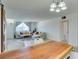 Open concept living room with whitewashed wood flooring and comfortable seating and bright natural light at 3930 University Center Dr # 409, Las Vegas, NV 89119