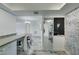 Bright open floor plan featuring whitewashed floors and modern design elements at 3930 University Center Dr # 409, Las Vegas, NV 89119