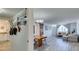Bright living room and kitchen features modern decor, an open layout, and whitewashed wood flooring at 3930 University Center Dr # 409, Las Vegas, NV 89119