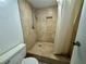 Tiled shower with stone tile and rainfall showerhead at 3930 University Center Dr # 409, Las Vegas, NV 89119