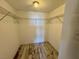 Walk-in closet with wire shelving, a light fixture, and space for organizing clothes and belongings at 3930 University Center Dr # 409, Las Vegas, NV 89119
