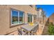 Cozy backyard patio with stylish outdoor dining furniture and desert landscaping at 4754 Bluebird Cliffs Ave Dr # Lot 170, Las Vegas, NV 89141