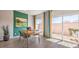 Stylish dining area with a view to the outside, modern furniture, and a slider door to the patio at 4754 Bluebird Cliffs Ave Dr # Lot 170, Las Vegas, NV 89141