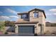 Charming two-story home with a tile roof, blue garage door, and desert landscaping for low maintenance at 4754 Bluebird Cliffs Ave Dr # Lot 170, Las Vegas, NV 89141