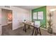Functional home office area featuring a desk, sliding closet doors, and stylish decor at 4754 Bluebird Cliffs Ave Dr # Lot 170, Las Vegas, NV 89141