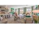 Bright living space with modern decor, wood-look floors, and a view of the backyard, perfect for entertaining at 4754 Bluebird Cliffs Ave Dr # Lot 170, Las Vegas, NV 89141