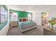 Serene main bedroom with decorative accent wall, plush carpet, and ensuite bathroom access at 4754 Bluebird Cliffs Ave Dr # Lot 170, Las Vegas, NV 89141