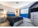 Cozy bedroom with a queen bed, soft carpet, TV, and a modern color scheme and aesthetic at 4786 San Rafael Ave, Las Vegas, NV 89120