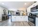 Modern kitchen with white cabinets, stainless steel appliances, and an open layout at 4786 San Rafael Ave, Las Vegas, NV 89120