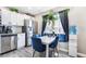 Cozy eat-in kitchen featuring stainless steel appliances and a modern dining set at 4786 San Rafael Ave, Las Vegas, NV 89120