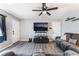 Comfortable living room with gray walls, wood-look flooring, and a plush sofa at 4786 San Rafael Ave, Las Vegas, NV 89120