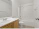 Clean, bright bathroom featuring a vanity and shower-tub combo at 4972 Groveland Ave, Las Vegas, NV 89139