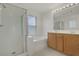 Bright bathroom with a walk-in shower, soaking tub, and double vanity at 4972 Groveland Ave, Las Vegas, NV 89139