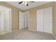Bedroom with neutral carpet, closet and bathroom doorway at 4972 Groveland Ave, Las Vegas, NV 89139