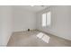 Neutral bedroom with a window offering natural light, and a carpeted floor at 4972 Groveland Ave, Las Vegas, NV 89139