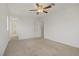 Spacious bedroom with carpeted floor, and doorway to bathroom at 4972 Groveland Ave, Las Vegas, NV 89139