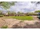 Recreational green space with a park, trees, and plants in the community at 4972 Groveland Ave, Las Vegas, NV 89139