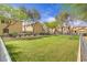 Beautiful community park with a fence and lush green grass at 4972 Groveland Ave, Las Vegas, NV 89139