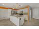 Well-lit kitchen with a center island, stainless steel appliances, and stylish pendant lighting at 4972 Groveland Ave, Las Vegas, NV 89139