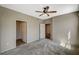Spacious bedroom boasts neutral paint, carpeting, and a door that opens to reveal flooring in the next room at 50 Aura De Blanco St # 19103, Henderson, NV 89074