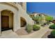 Welcoming condo entrance with private front door, neutral paint, and desert landscaping at 50 Aura De Blanco St # 19103, Henderson, NV 89074