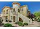 Charming condo with a stucco exterior, private balcony, and desert landscaping at 50 Aura De Blanco St # 19103, Henderson, NV 89074