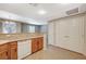 Open kitchen area featuring granite countertops and a view to the dining and living areas at 50 Aura De Blanco St # 19103, Henderson, NV 89074