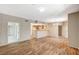 Open-concept living space with a kitchen bar and stylish flooring at 50 Aura De Blanco St # 19103, Henderson, NV 89074