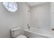 Bathroom with a soaking tub and white tiled walls at 5588 Ness Ave, Las Vegas, NV 89118