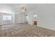 Primary suite with neutral carpet, ceiling fan, closet, and bathroom with oak vanity at 5588 Ness Ave, Las Vegas, NV 89118