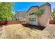 Home exterior with brick walls, yard, and trees at 5588 Ness Ave, Las Vegas, NV 89118