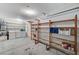 Spacious garage with laundry appliances and shelving units at 5588 Ness Ave, Las Vegas, NV 89118