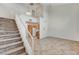 Open-concept living area features tile floors, high ceilings, and staircase leading to the second floor at 5588 Ness Ave, Las Vegas, NV 89118