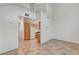 Open-concept living area with tile floors, staircase, and kitchen access, creating an inviting space at 5588 Ness Ave, Las Vegas, NV 89118