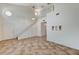 Spacious living area features tile flooring, high ceilings, and a staircase leading to the second floor at 5588 Ness Ave, Las Vegas, NV 89118