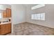 Spacious living area with tile floors, high ceilings, and access to the adjacent kitchen at 5588 Ness Ave, Las Vegas, NV 89118