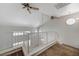 Upper landing features a carpeted floor, white railing and views to the floor below at 5588 Ness Ave, Las Vegas, NV 89118