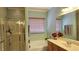 Relaxing bathroom with a soaking tub and separate glass-enclosed shower at 5772 Flying Birdie Ave, Las Vegas, NV 89122