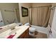 Clean bathroom featuring a tub with shower, framed mirror and modern sink at 5772 Flying Birdie Ave, Las Vegas, NV 89122