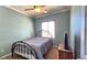 Cozy bedroom with a ceiling fan, natural light and light-blue painted walls at 5772 Flying Birdie Ave, Las Vegas, NV 89122
