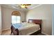 Bedroom with a comfortable bed and neutral decor at 5772 Flying Birdie Ave, Las Vegas, NV 89122