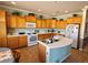 Spacious kitchen with island and white appliances at 5772 Flying Birdie Ave, Las Vegas, NV 89122