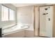 Bathroom featuring soaking tub and a walk-in shower at 5921 Royal Castle Ln, Las Vegas, NV 89130