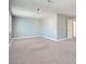 A spacious bedroom featuring a neutral color palette and soft carpeting at 5921 Royal Castle Ln, Las Vegas, NV 89130