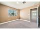 This spacious bedroom has plush carpeting and neutral-toned walls, providing a serene atmosphere at 5921 Royal Castle Ln, Las Vegas, NV 89130