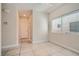 Tiled entry way featuring a large window, allowing for natural light at 5921 Royal Castle Ln, Las Vegas, NV 89130